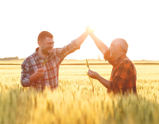 Two farmer standing in a wheat field 👍
